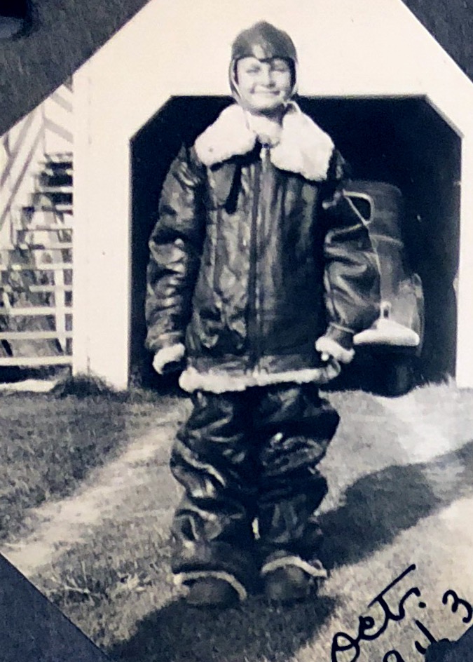 Keith Miles, age 10, wearing flight suit belonging to his Army Air Corp pilot brother. October 1943