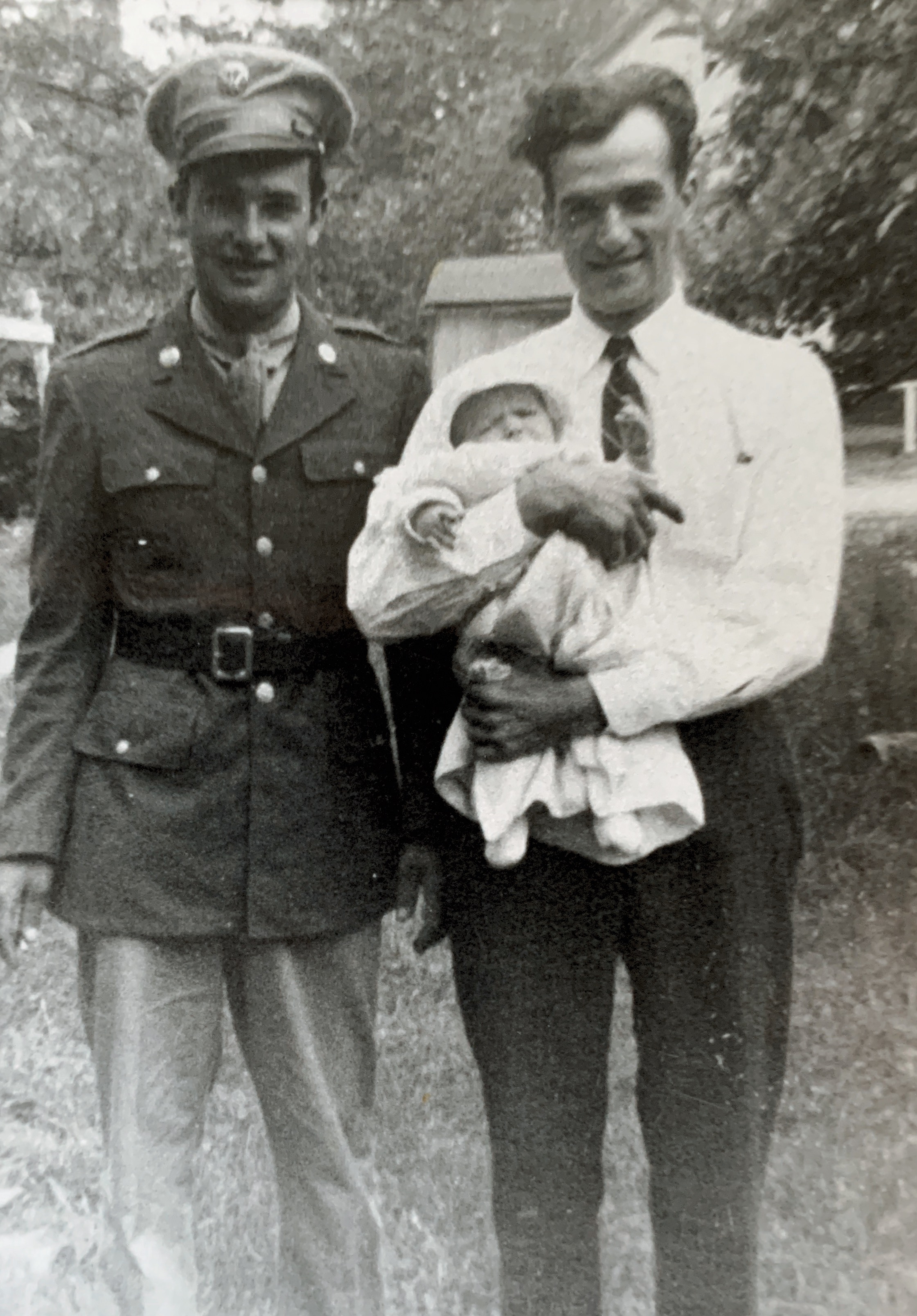 Baptism 1943 - Gary Blackburn in uniform, and Louis Blackburn holding son Larry. 