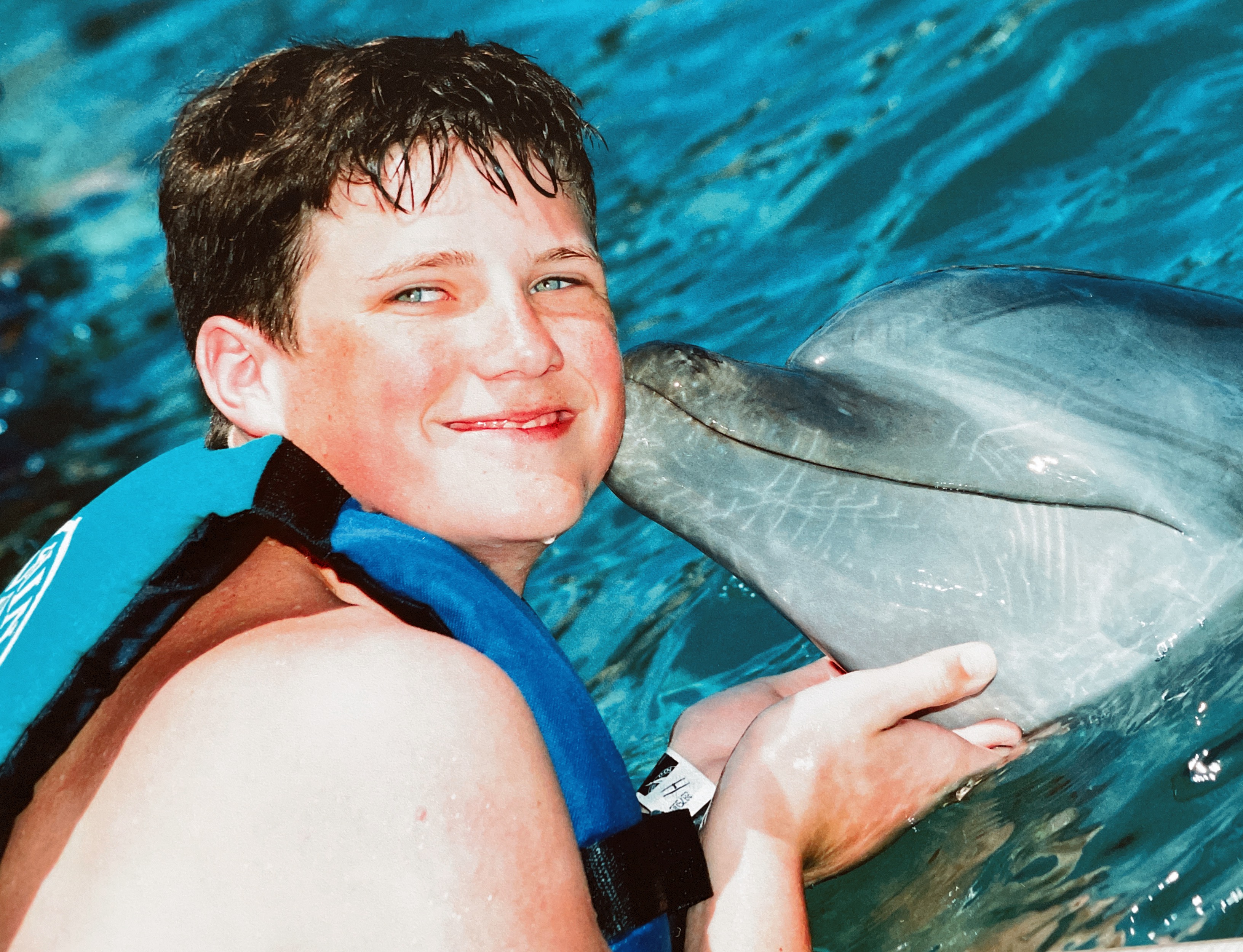 Patick swimming with the dolphins in Mexico..Disney 2006