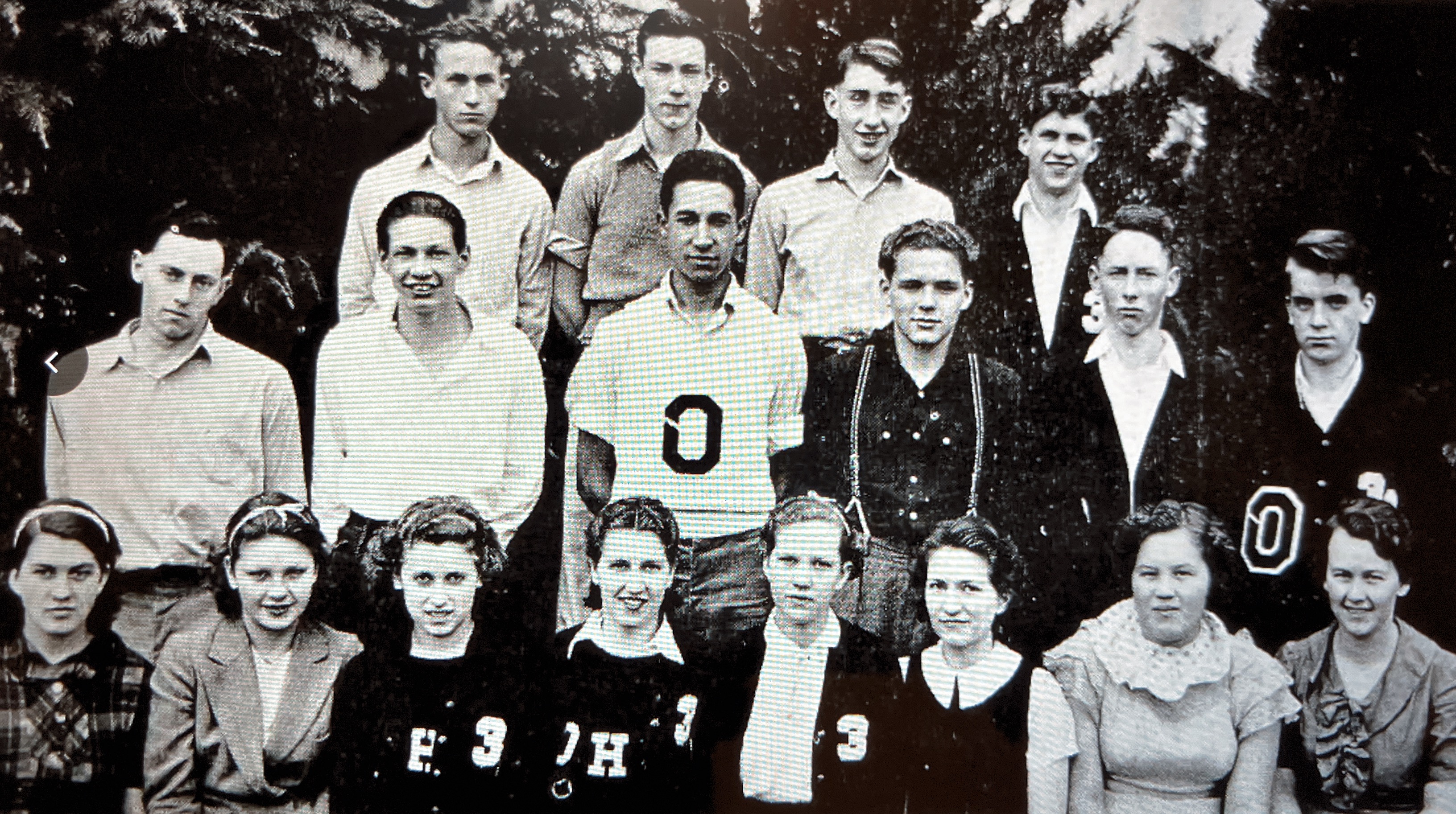 Class of 1938 in their junior class photo.  Lester is second from left in the middle row.