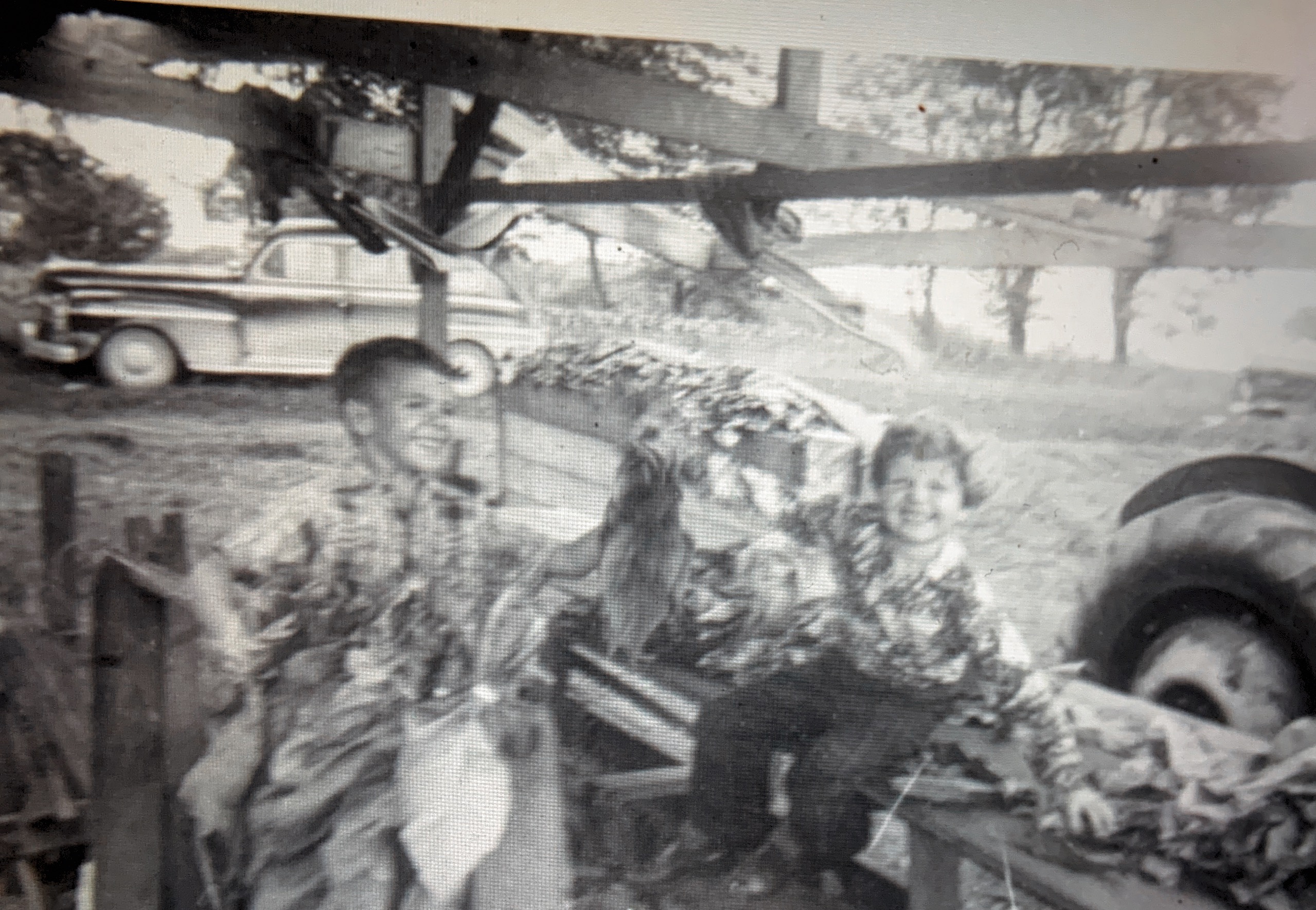 My brother Eric and Myself helping on our parents Tobacco Farm. Getting Tobacco leaves ready to be cured. We had great times growing up on the farm in the mid 1950s.