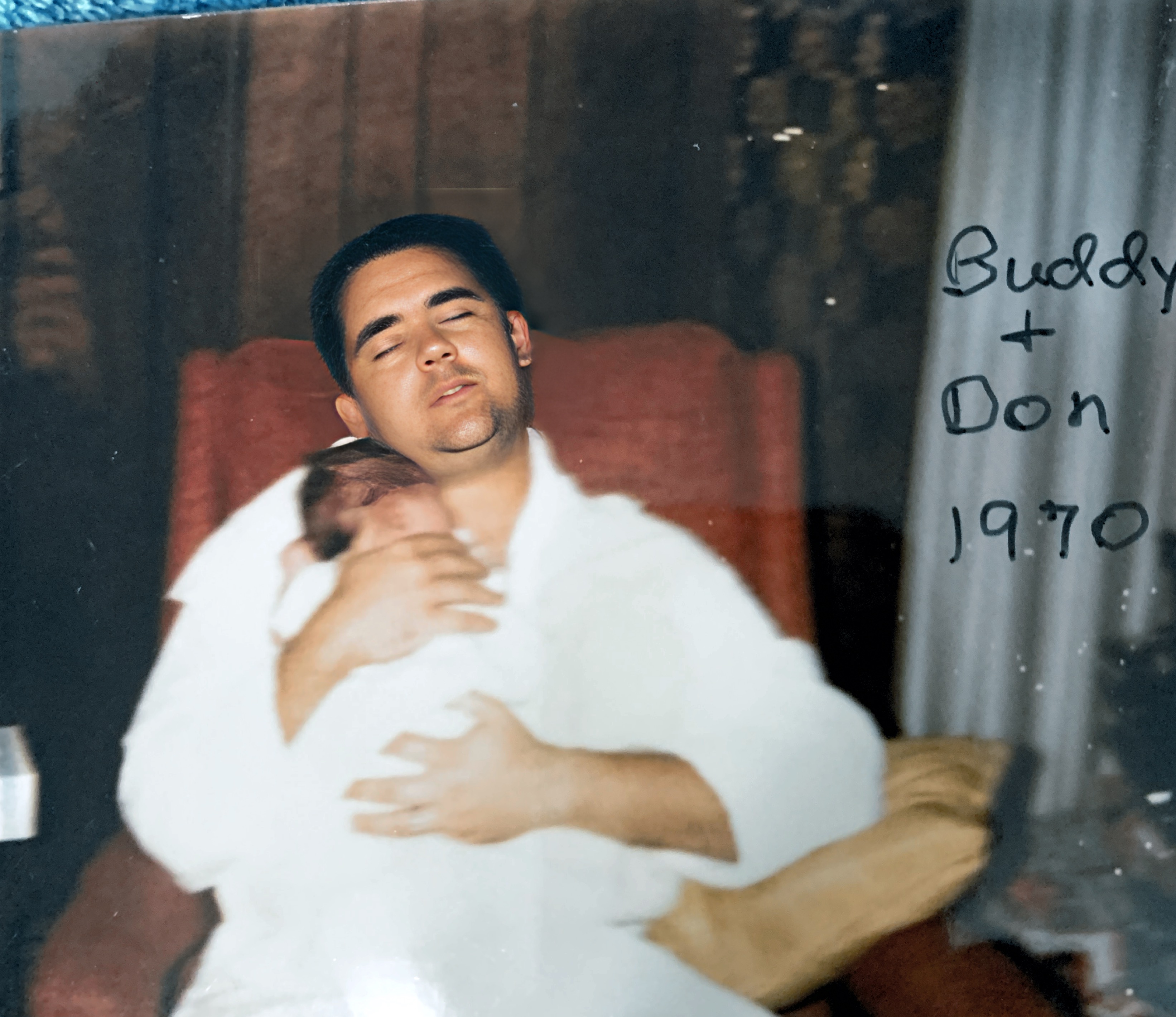 Don Buddy Dec, 1970. Buddy had flown over 24 hours, exhausted. But determined that I should take a nap.  I did and he napped w/2 week old Don.