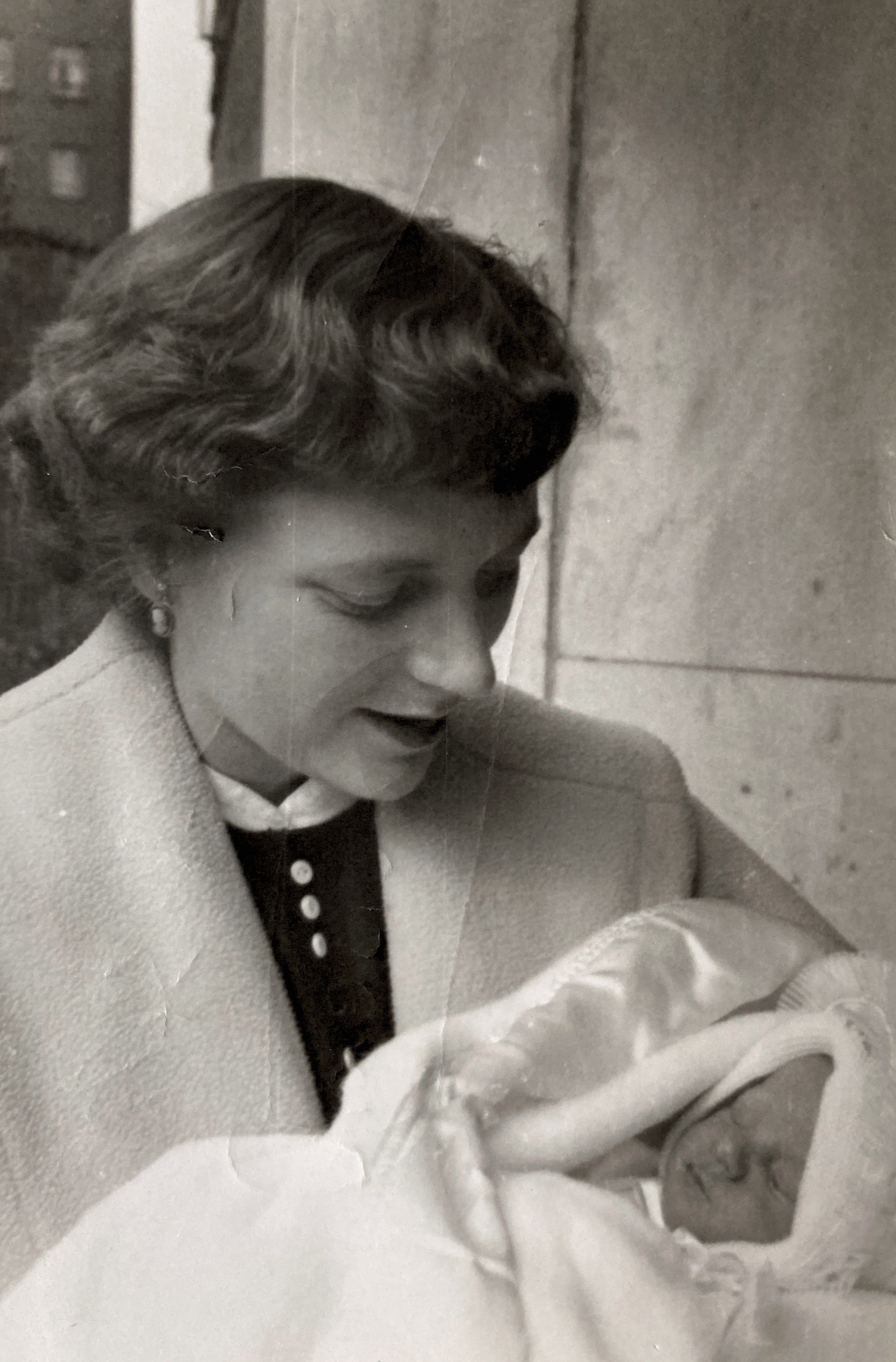 Elizabeth La Vergne holding Her son Paul at his baptism. Around 1957.