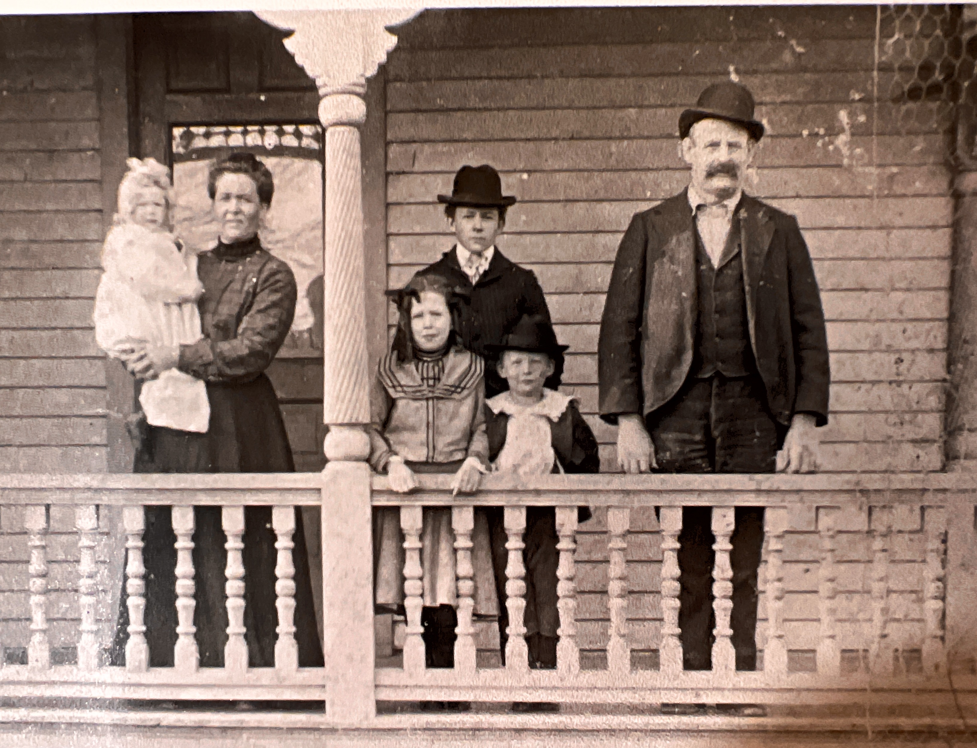 Infant Mary (Mike), Elizabeth Alley Benson Horick, Helen Horick, Robert (Bob) Horick, (Arthur) Ross Horick, John William Horick, at their home in Bucyrus, Ohio, probably around 1904.