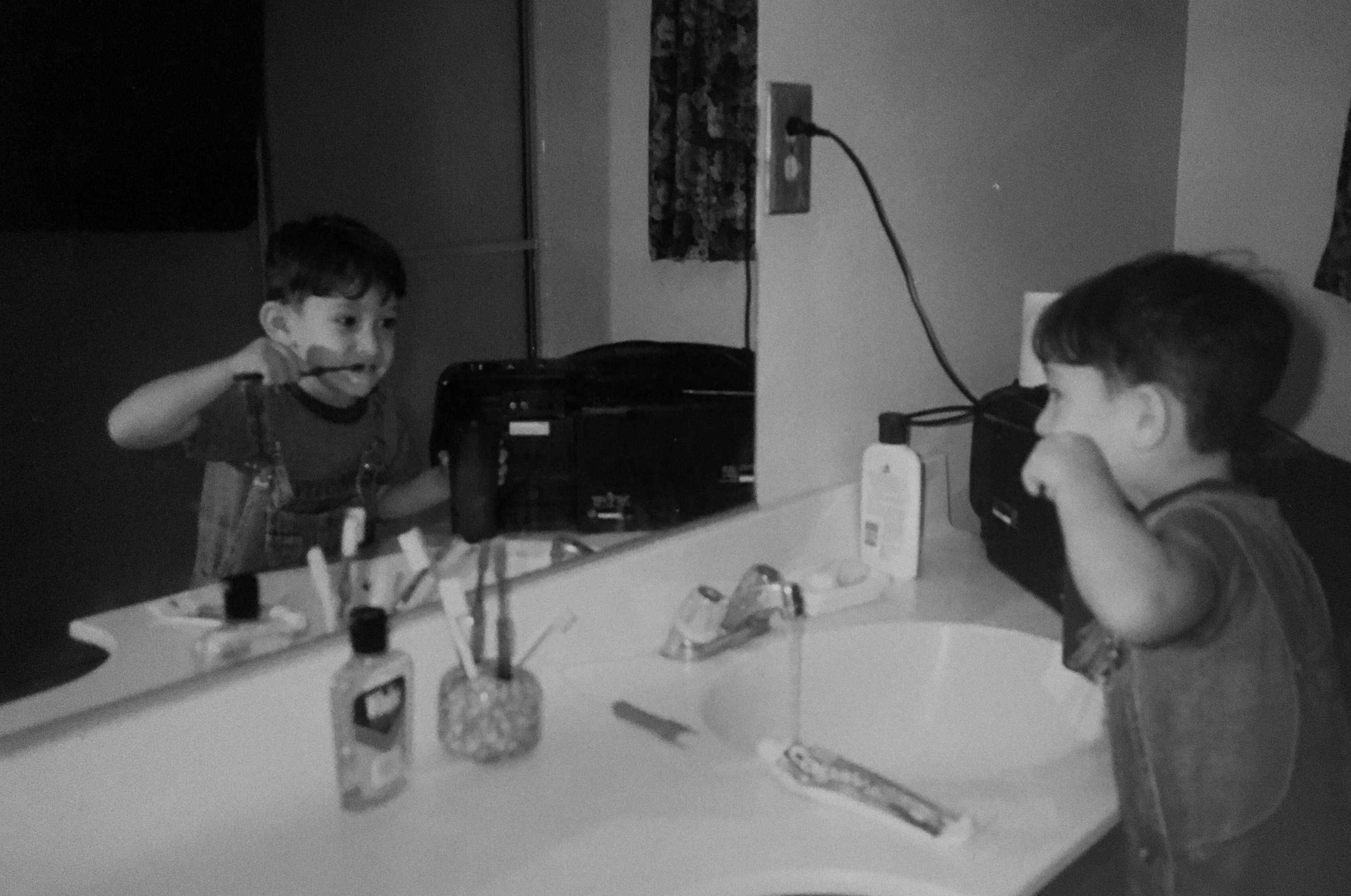 Matthew Rodriguez, 3 years old, learning to brush his teeth. San Bernardino, California, c. 1996