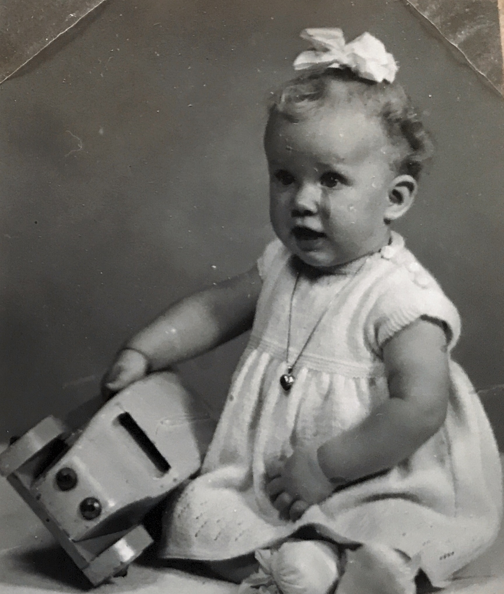 It’s a photo of me, in 1954 when my mother took me to a professional photography studio