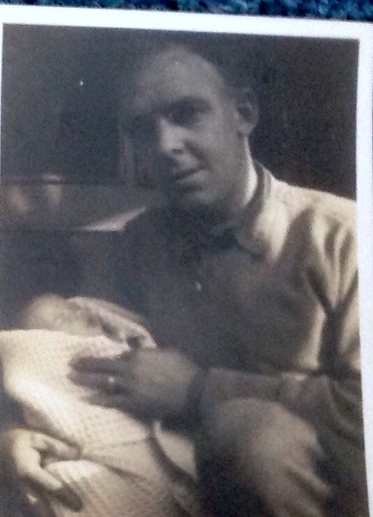 My dad with me as a baby 1945