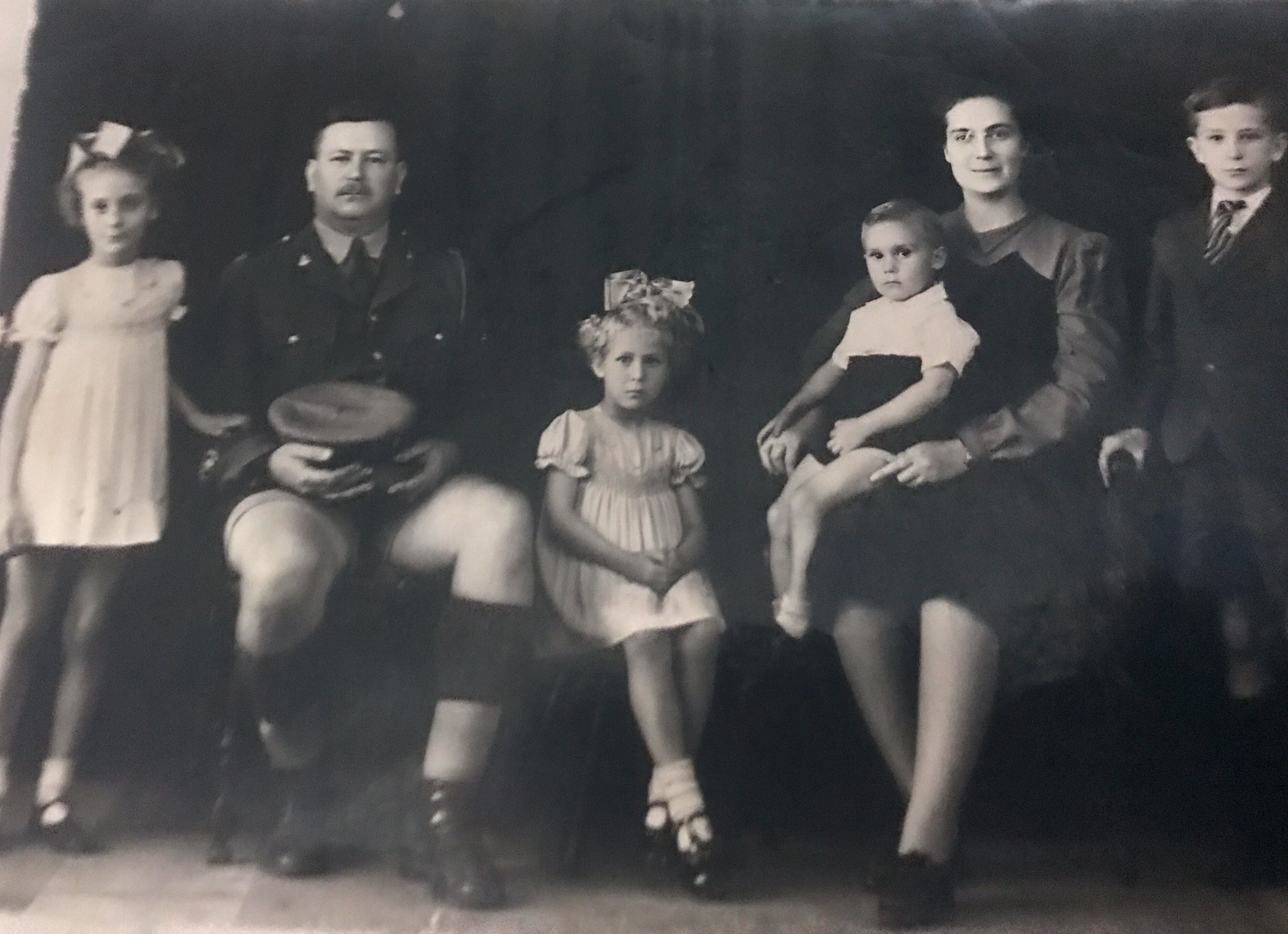 My Grand father - Hannes C Ras  being a sargent in  World War 2 Surviving with medals of Hounour With his family  My grandma   Ella Ras And thier 4 Children From L to R  My Mother Johanna Catharina (Rina) Sister Cornelia (Nelie Brother Martinus  Brother Wilhelm Foto taken  +_ 1945   