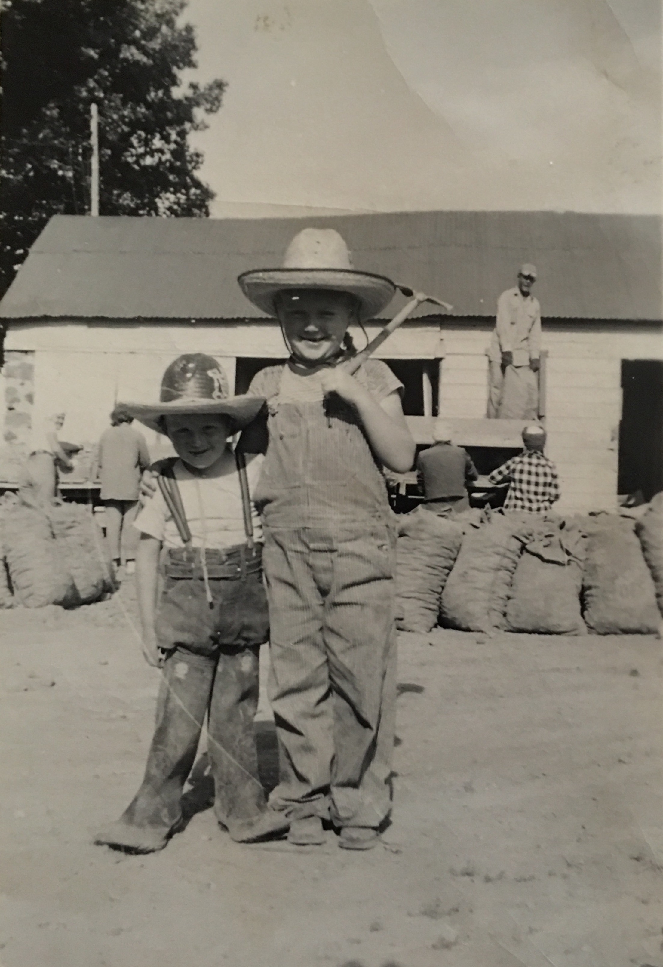 Weldon in boots, Reida with shovel.  Bosieger farm, Shoshone, Idaho 1948
