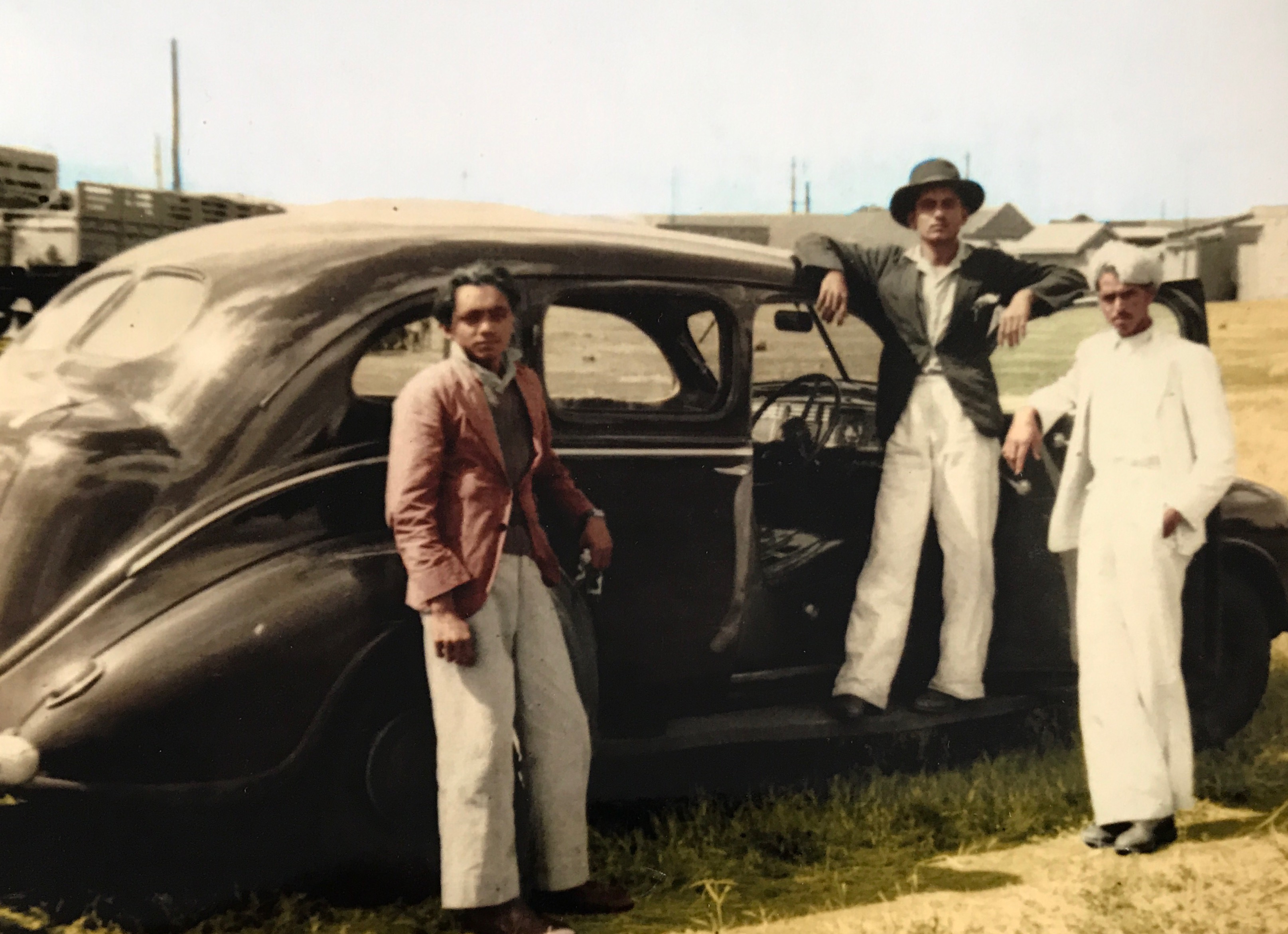 Meghjibhai Parmanand Dhokia and his car with two unknown persons in Nairobi Kenya in around 1945.