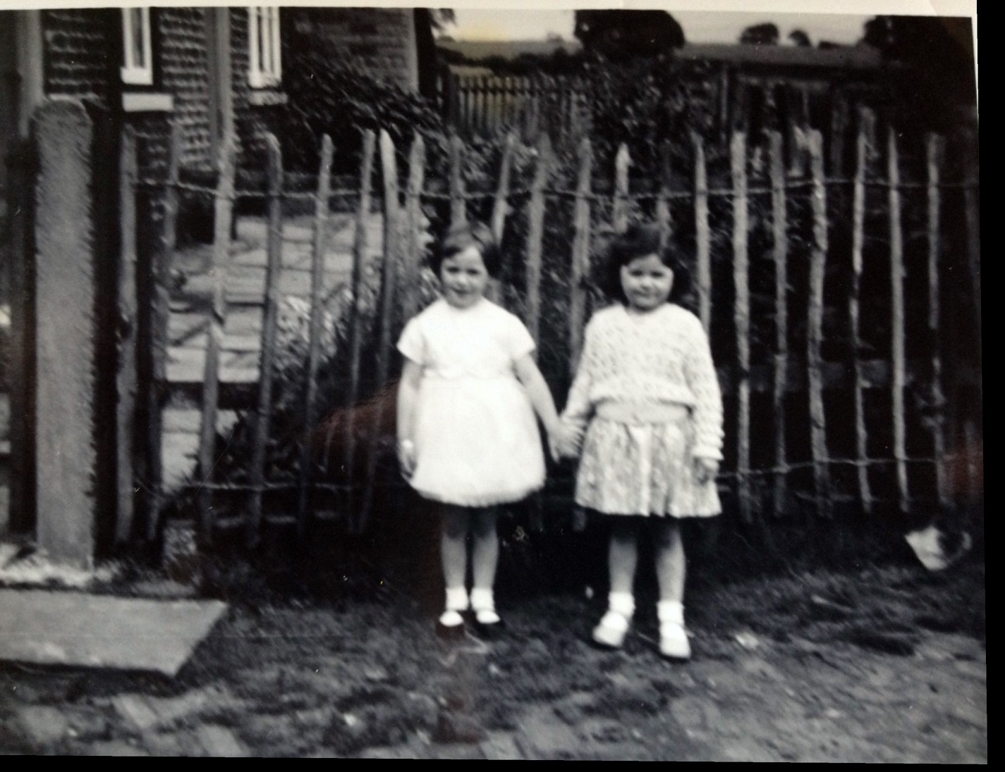 My sister & cousin outside our grandads farm 1960's
