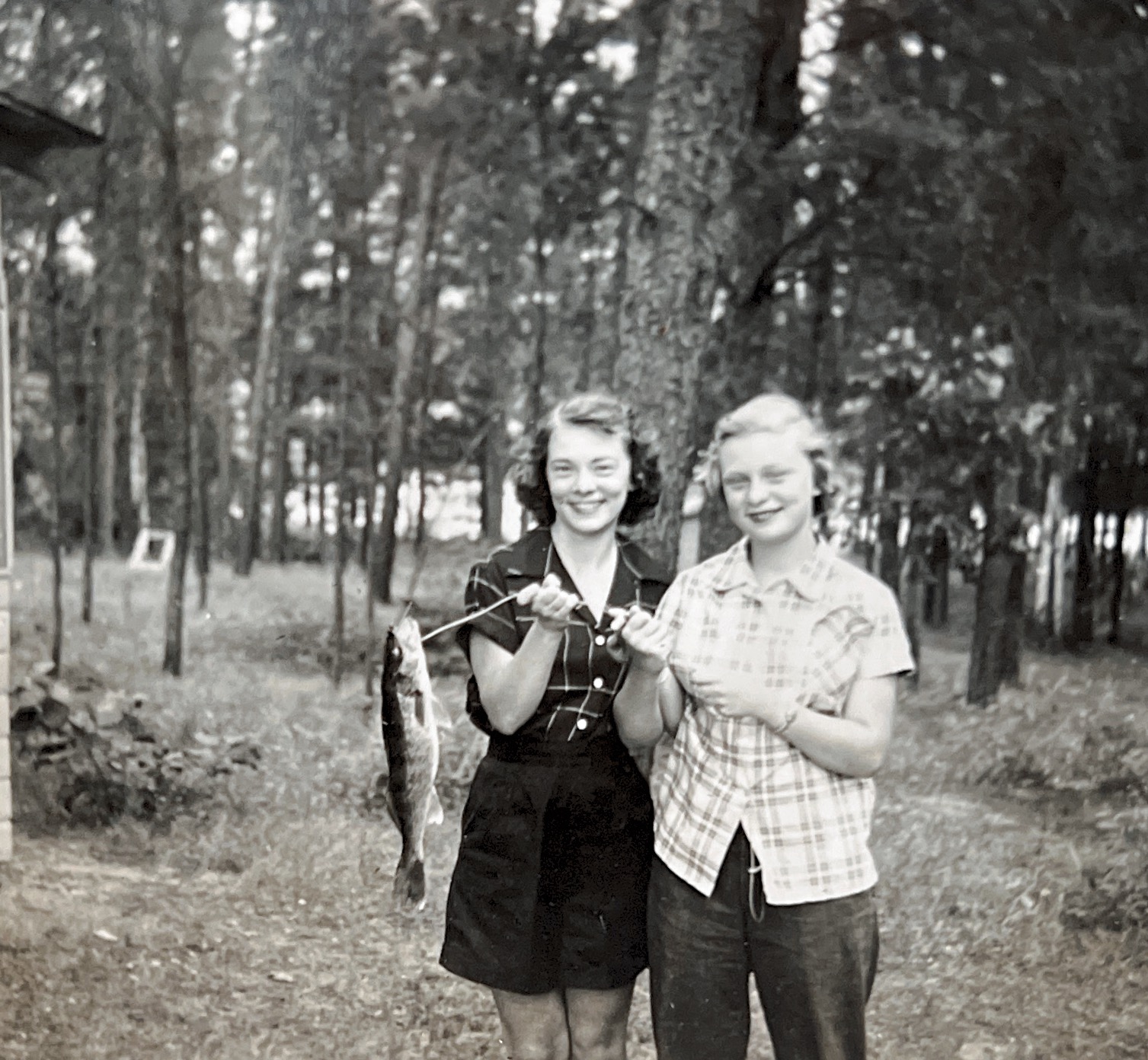 Sisters in 1950 Minnesota with fresh catch