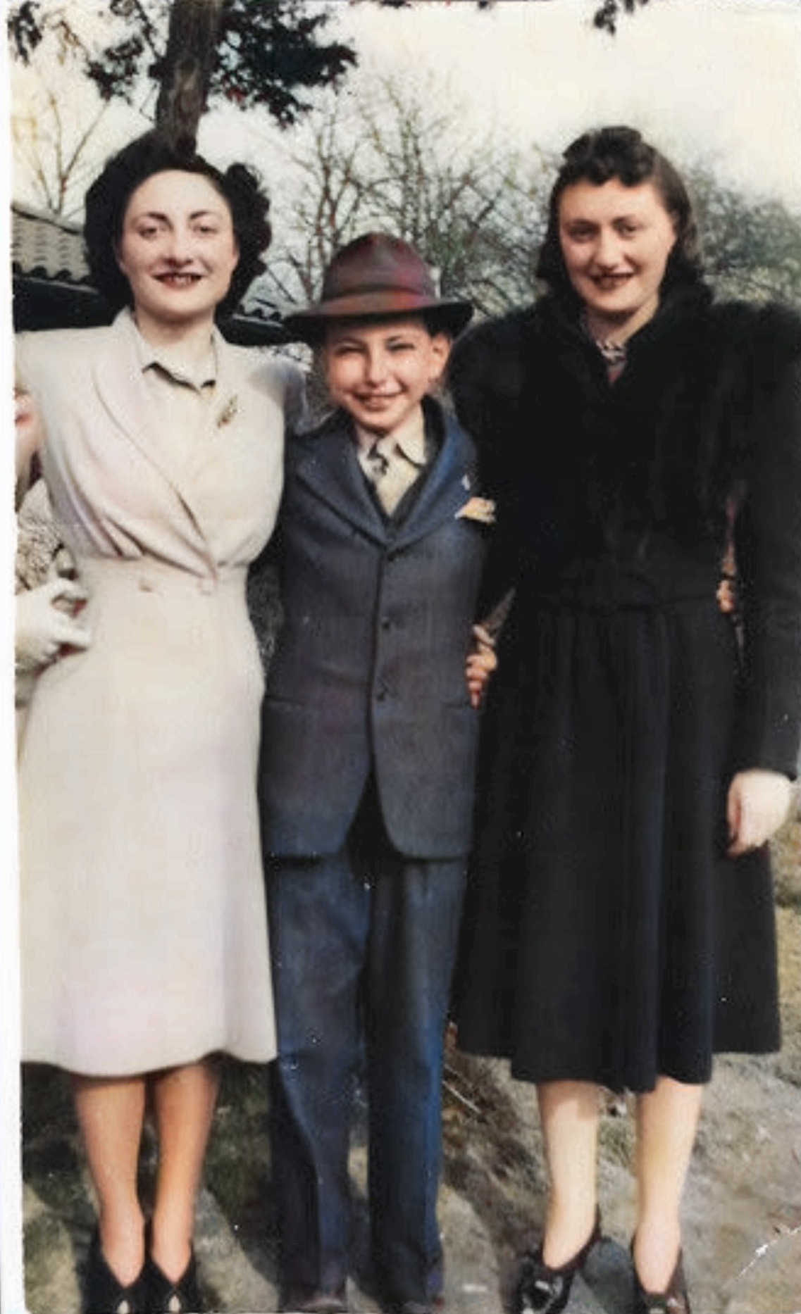 My father centered with his older sisters, Philadelphia around 1940