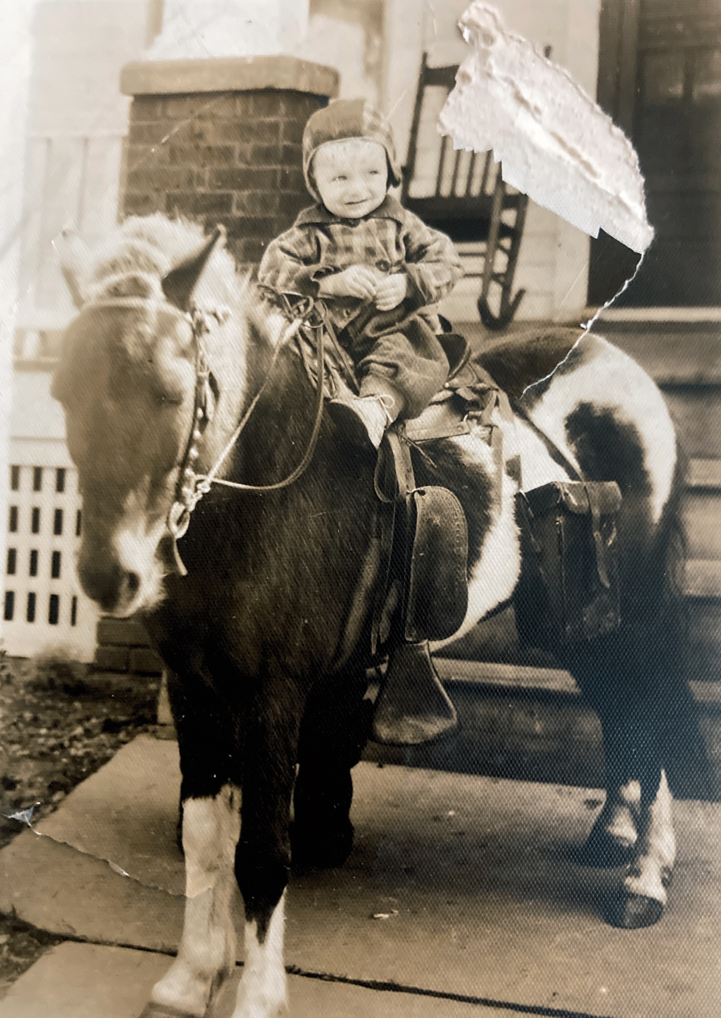 Bernard Cielec on a horse in front of his house. Circa 1940.