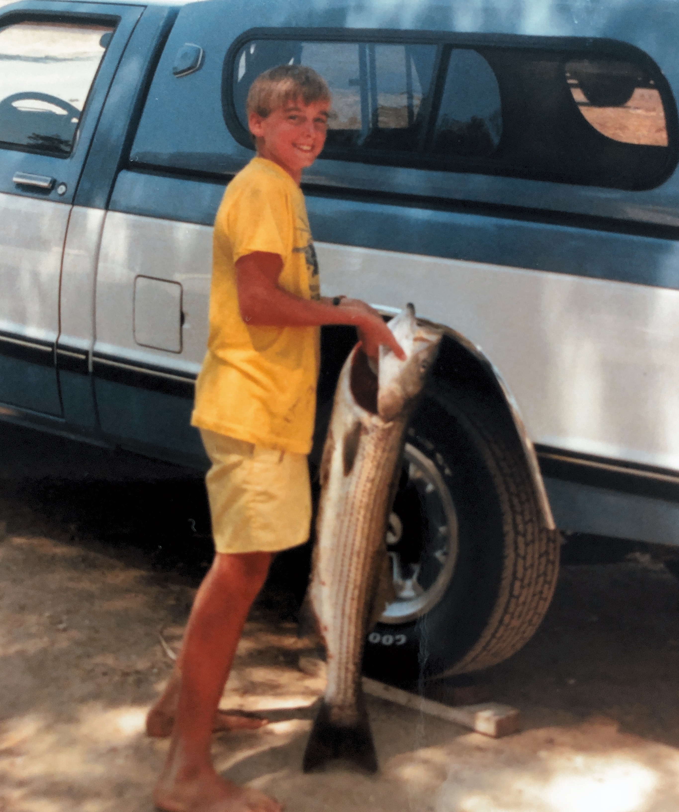 Jeremy catching a big fish while camping with the Fambam 1987