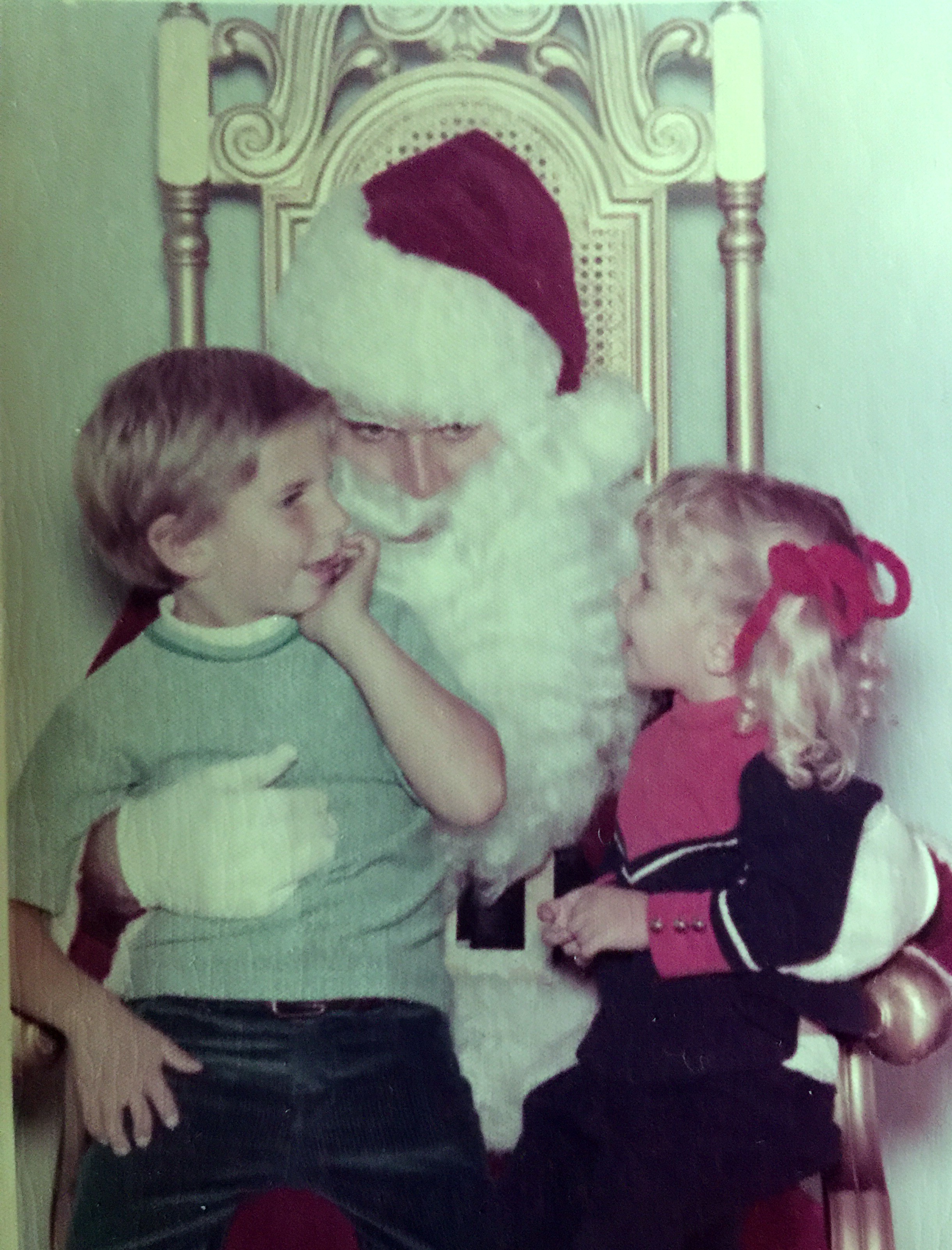
My son 6 yrs, and daughter 2, sitting on Santa's lap at the Mall in Torrance telling Santa their Christmas wishes. 