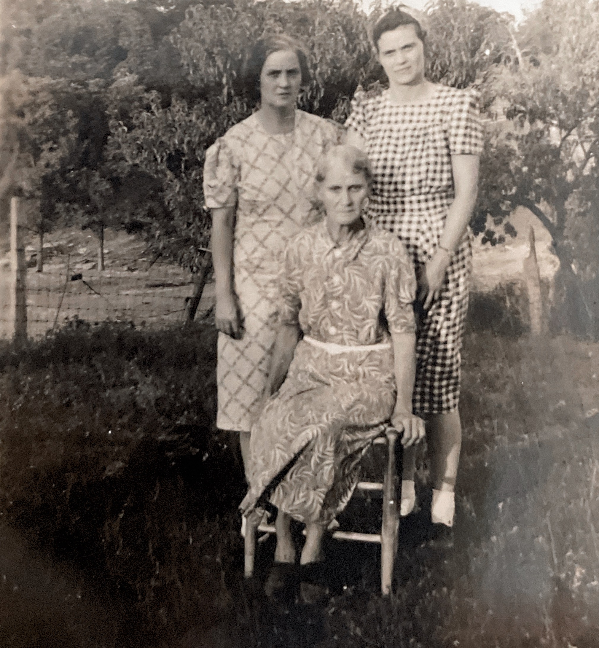 Ellen Damron Brown and Addie Damron Pulver seated Mae Rose Damron. 1941-1943