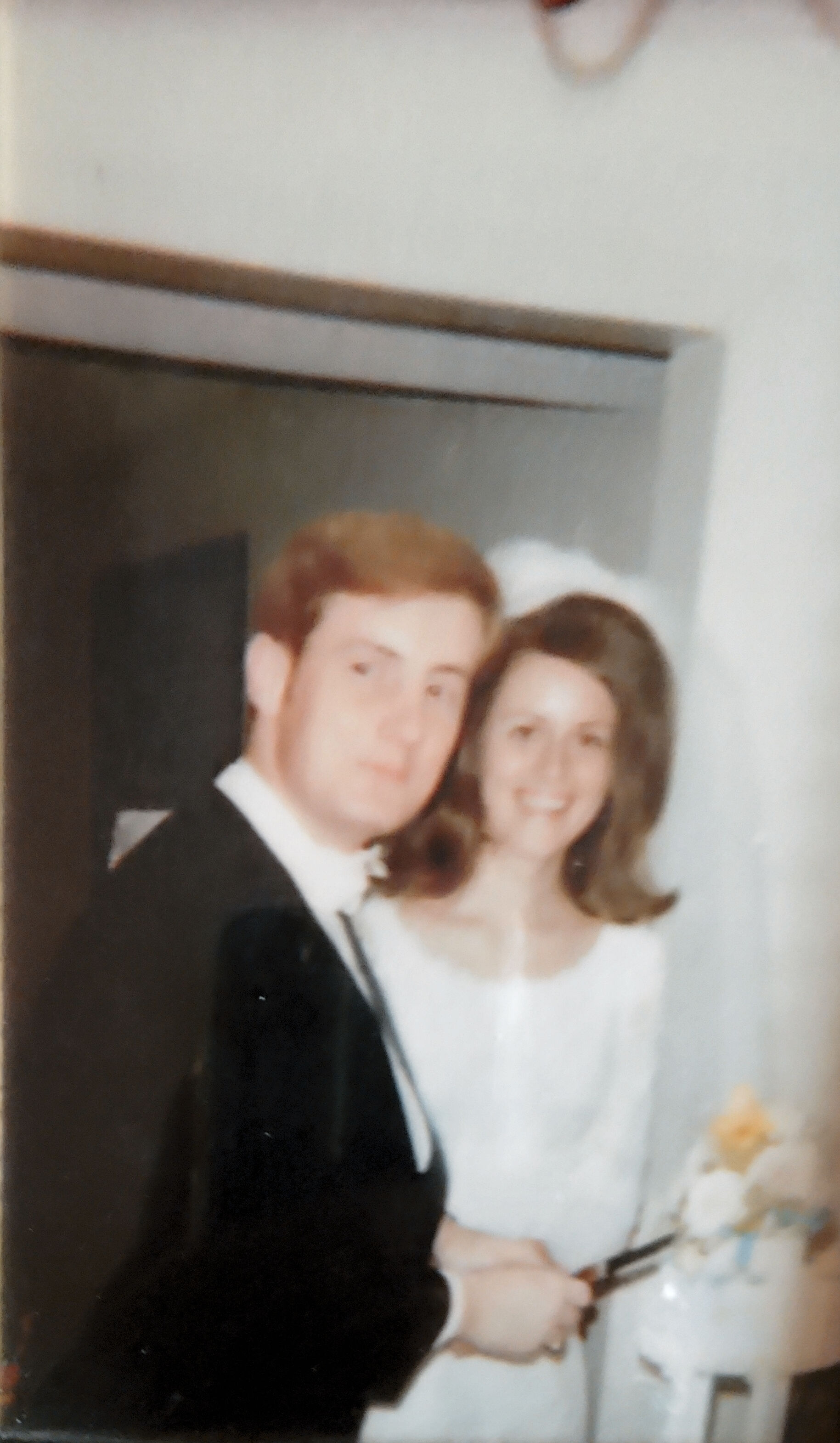 Our only picture of our wedding on June 12, 1970 which took place in Duke Umivercity  Chapel with one bridesmaid
