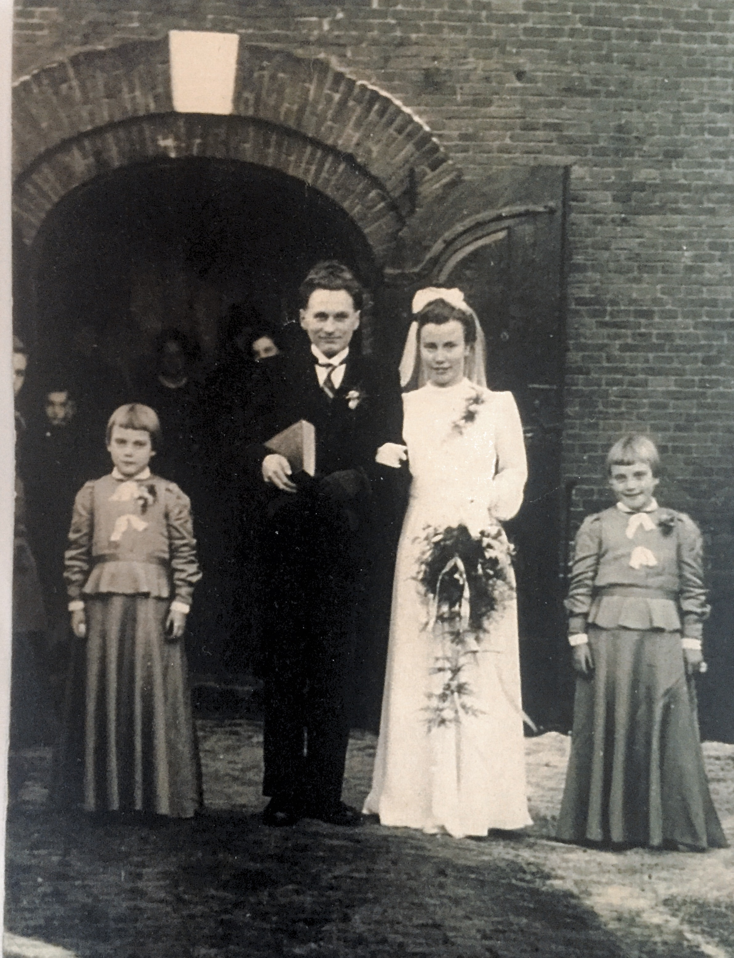 Jan 5, 1944. Geert DeVries and Griet VanderZwaag marriage. Tiny VZ and Hillie VZ mom‘s younger sisters were the bridesmaids. Mom‘s dress: a teacher in school was the daughter of the owner of a textile company and a school board member. She got mom, the fabric without ration points and made her the dress and a long slip, the veil was a friends which they cut down and remade. The shoes and white stockings were also the friends. Mom did not see her again until Oma‘s funeral. Geert wore a suit borrowed from a minister that his aunt Assel, a nurse ,used to for briefly when his child was born. That man also lent dad the necessary black gloves. The tall hat was borrowed from the blacksmith friends of Geert. The . The tie needed to be black-and-white. Oom Jap (Geert’s brother in law) was volunteered by his wife (Tante Wieke, Geert’s sister on the day of the wedding to exchange ties with dad. The girls dresses were made by.Tante Wieke ( Mom’s sister) out of curtain fabric from Opa’s store. Bows were made out of fabric. Normally used for underwear, shoulder straps.