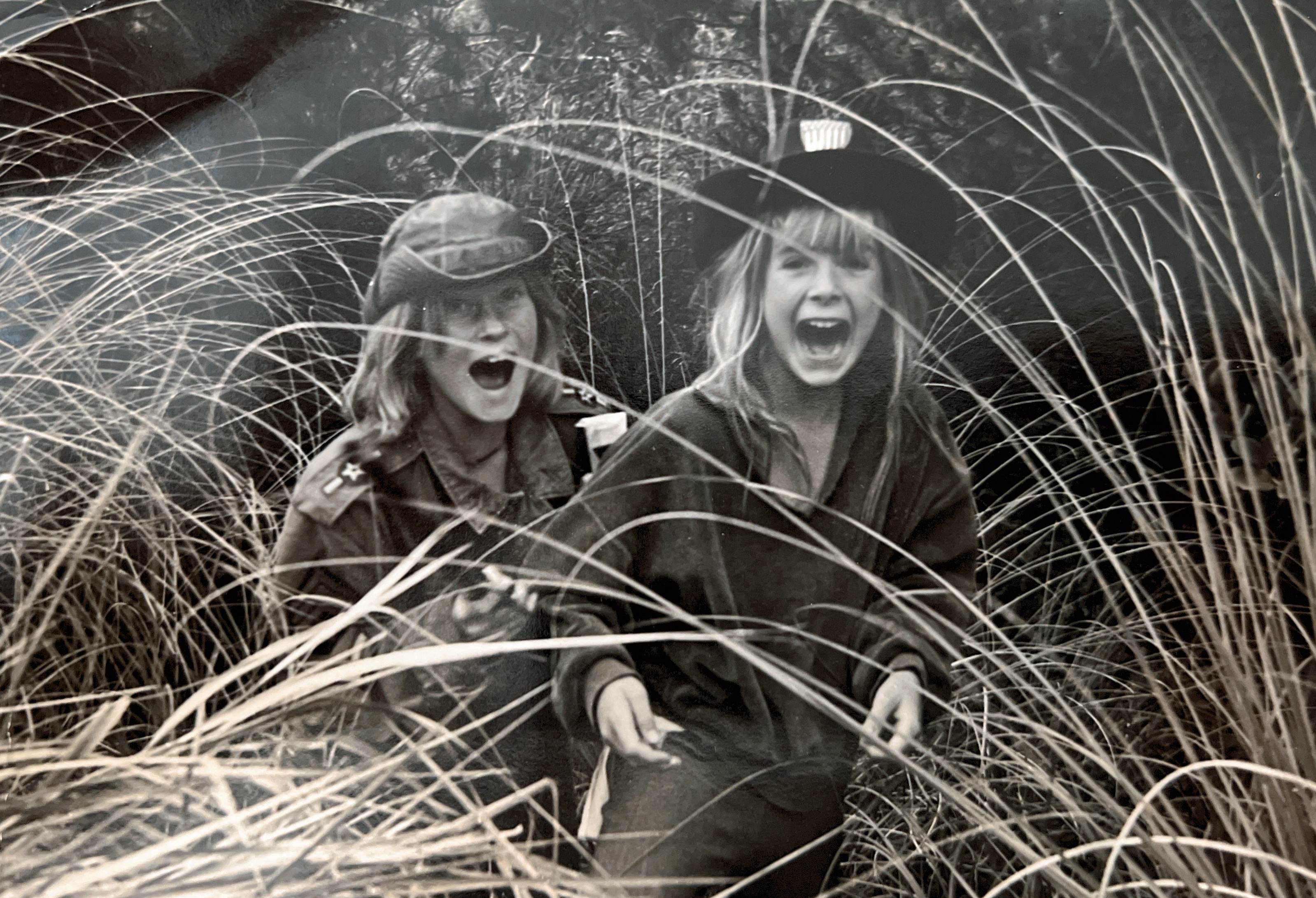 Classic photo of me and Vicky Dietrich in 1968. We were often the subject of Lindy‘s photography assignments (this one, kids at play). We had just done something a little bit naughty and were completely surprised to see her pop out of the bushes and take our picture.